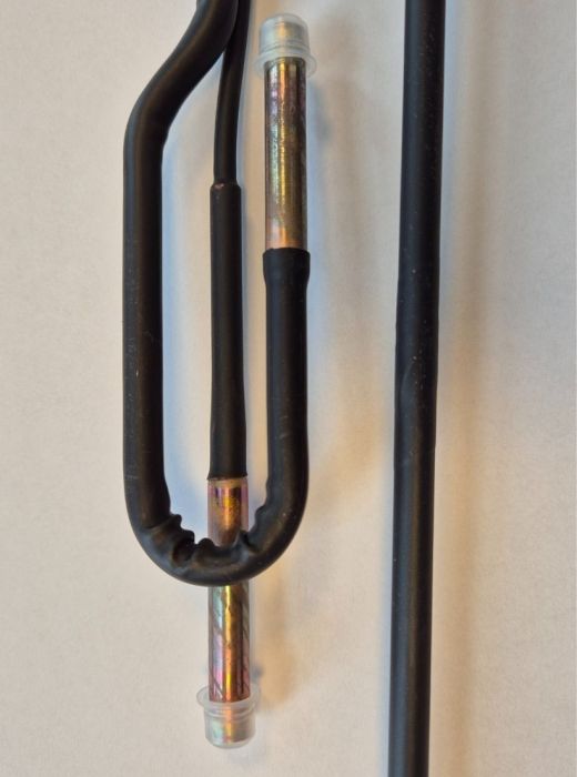 Copper tube assembly with heat-shrink insulation and sealed ends, manufactured for HVAC and refrigeration system components.