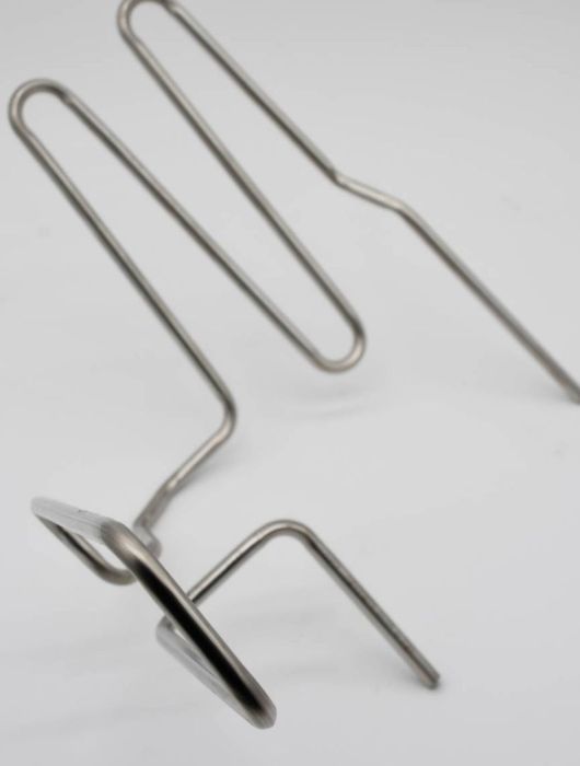 Stainless steel bent tubes with mounting brackets, custom-formed for HVAC and industrial system applications.