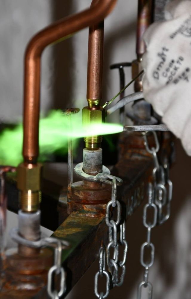 Certified brazing process on copper tube and brass fitting, ensuring leak-tight joints for HVAC and refrigeration systems.