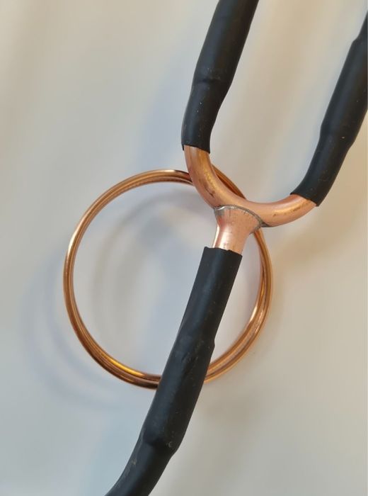 Copper tube assembly with brazed joint and heat-shrink insulation, designed for HVAC and refrigeration applications.